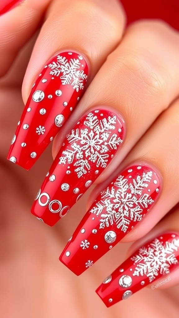 Long red Christmas nails with snowflake designs and glitter.